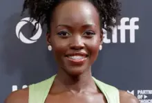 Lupita Nyong'o smiling at a film premiere